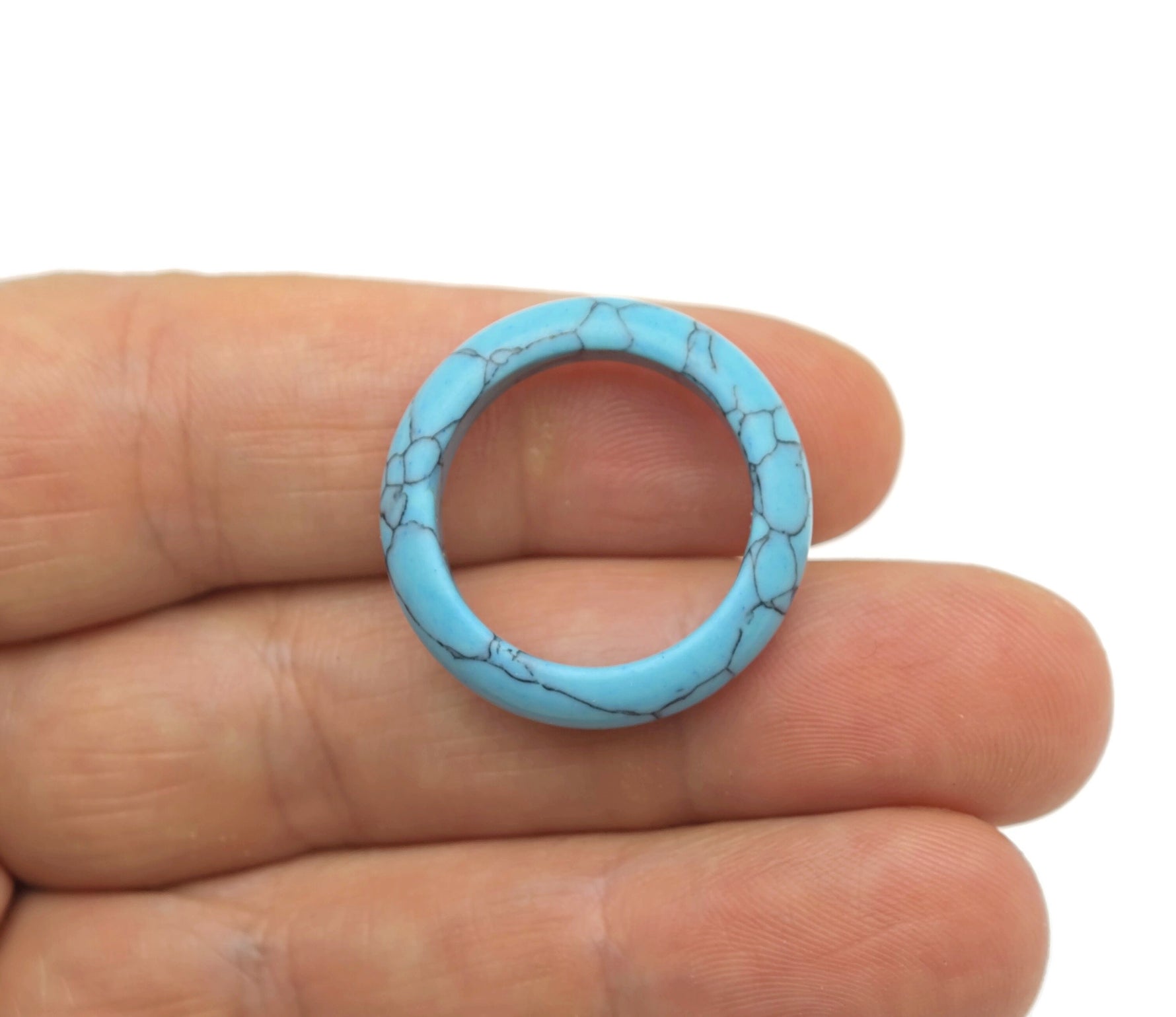 Turquoise crystal ring from GemstoneGO featuring a vibrant turquoise stone set in a silver band.