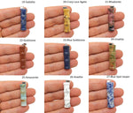 Bamboo-shaped crystal pendant from GemstoneGO with protective clear crystal, bamboo design, and jewelry setting.