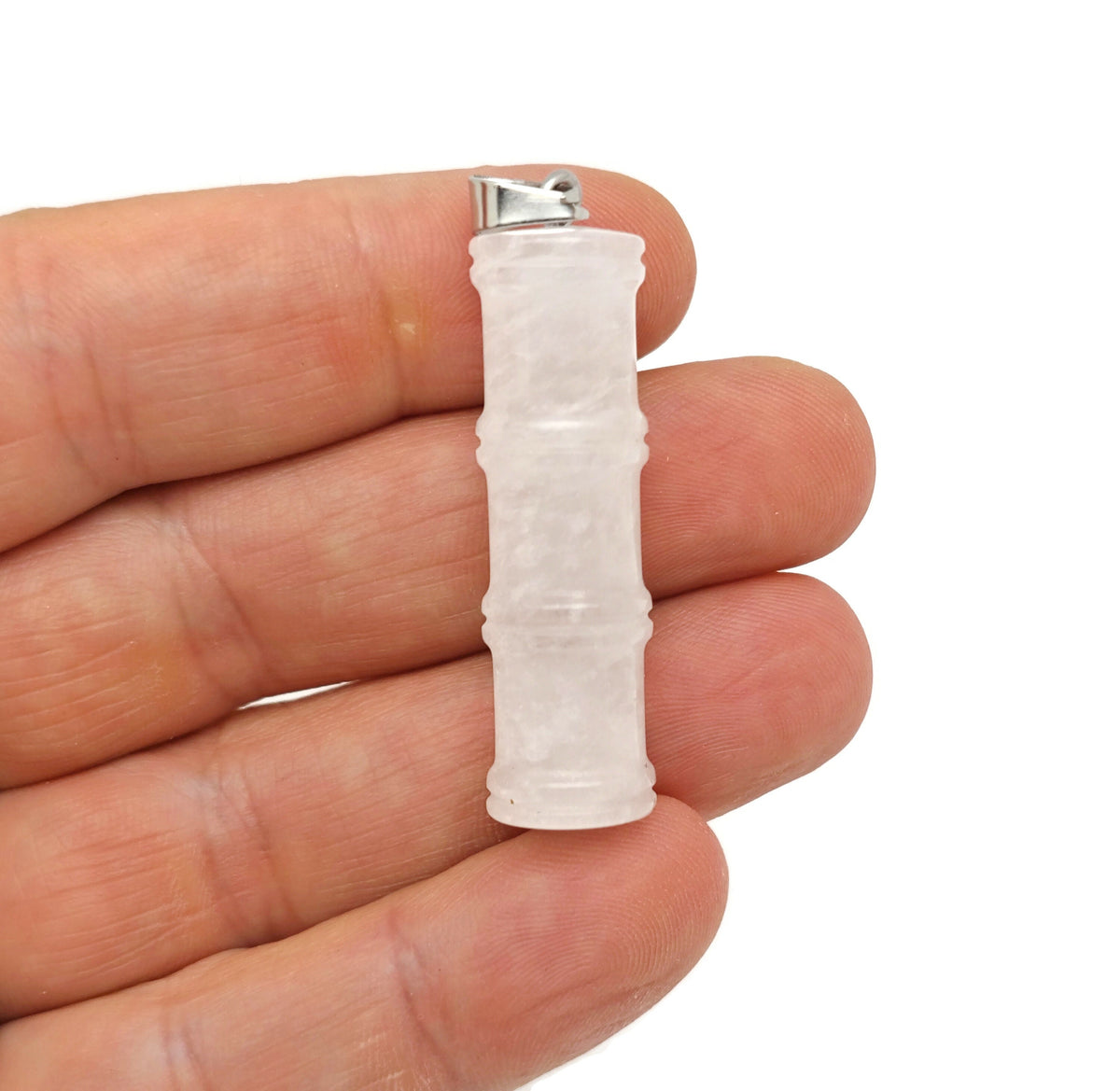 Clear quartz crystal pendant with bamboo shape, featuring a protective crystal design from GemstoneGO on a silver chain.