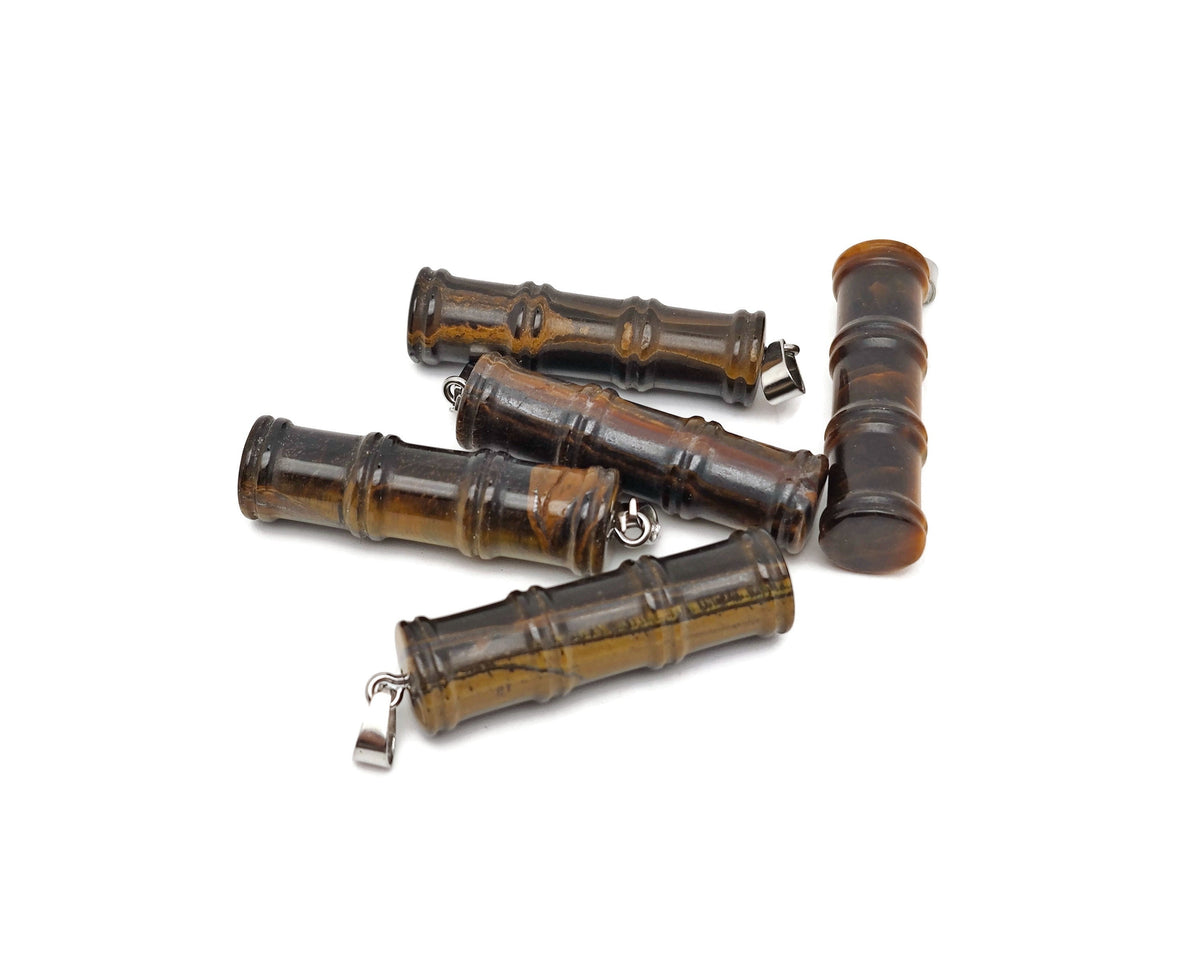 Tiger Eye bamboo-shaped crystal pendant from GemstoneGO featuring a protective crystal design on a chain.