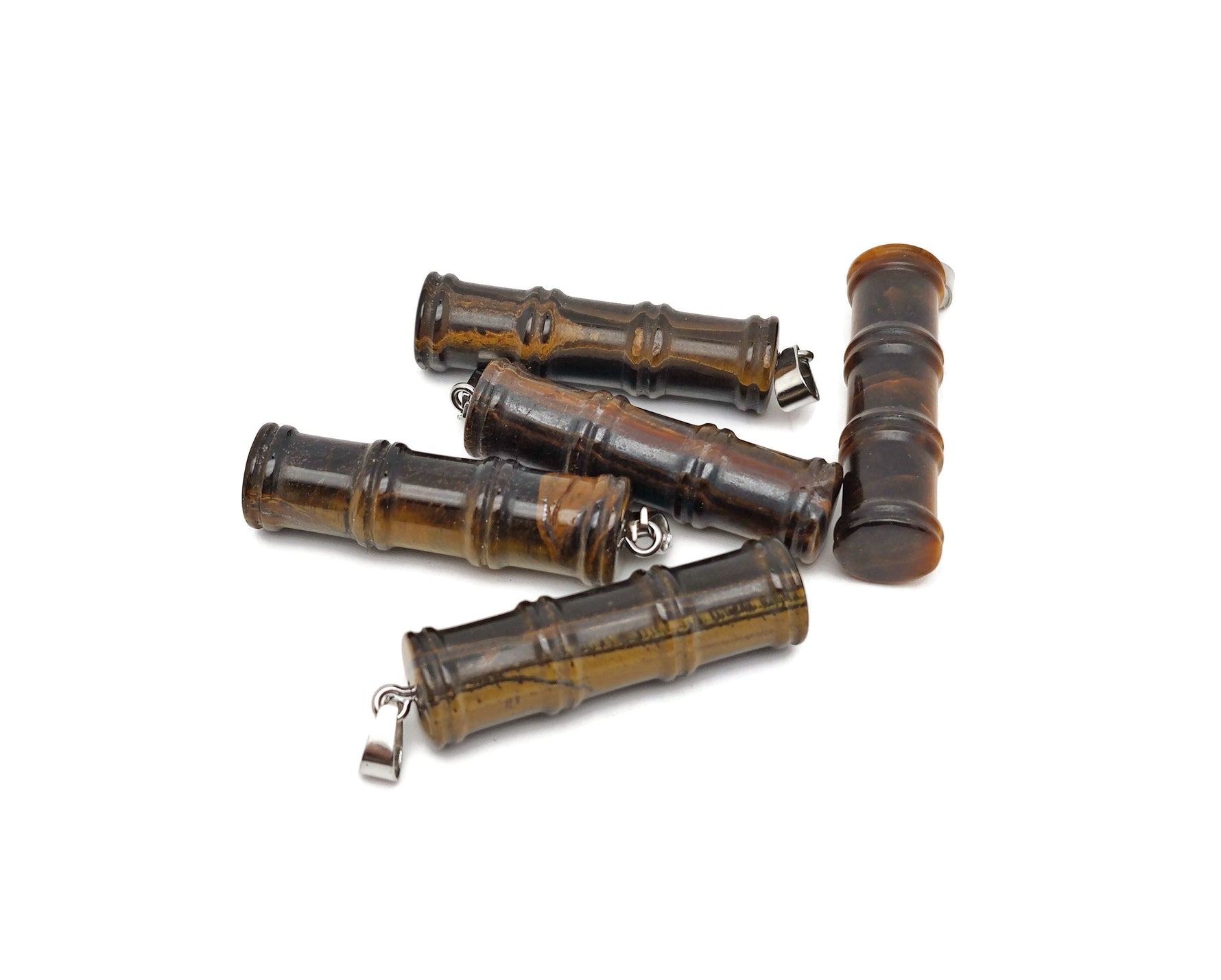 Tiger Eye bamboo-shaped crystal pendant from GemstoneGO featuring a protective crystal design on a chain.