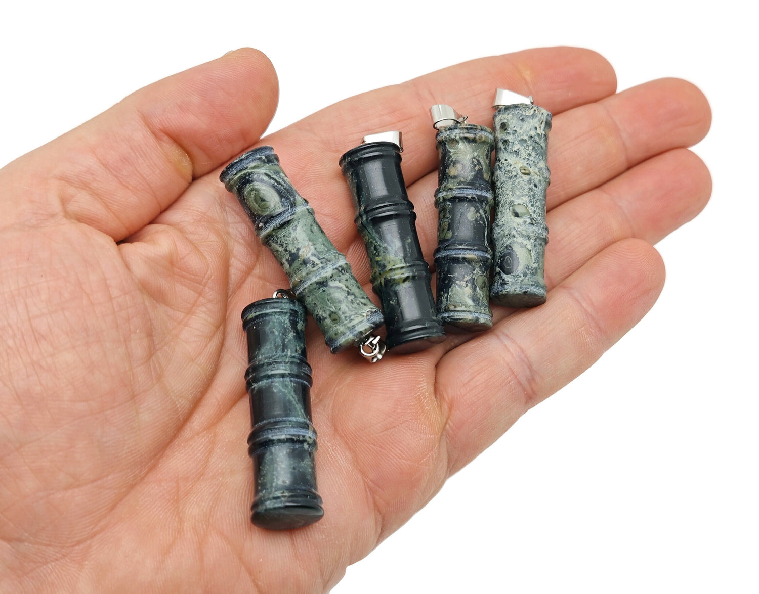 Kambaba Jasper bamboo-shaped crystal pendant with protective energy, featuring green and black swirling patterns, by GemstoneGO.