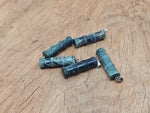 Kambaba Jasper bamboo-shaped crystal pendant from GemstoneGO, featuring a protective crystal design with green and black swirling patterns.
