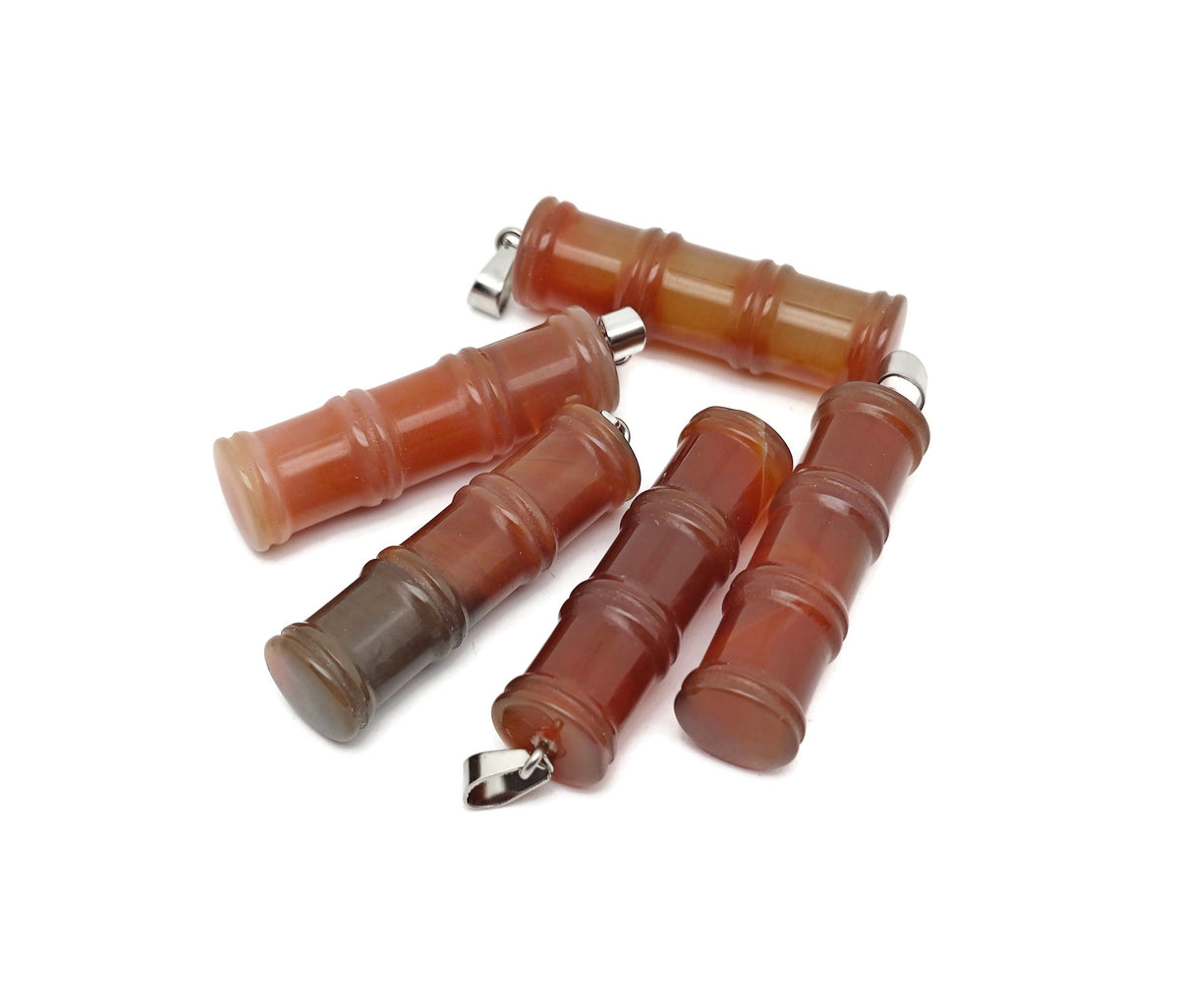 Carnelian bamboo-shaped crystal pendant with protective crystal design by GemstoneGO, showcasing vibrant orange stone on a cord.