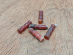 Carnelian bamboo-shaped crystal pendant from GemstoneGO featuring a protective crystal design on a silver chain.