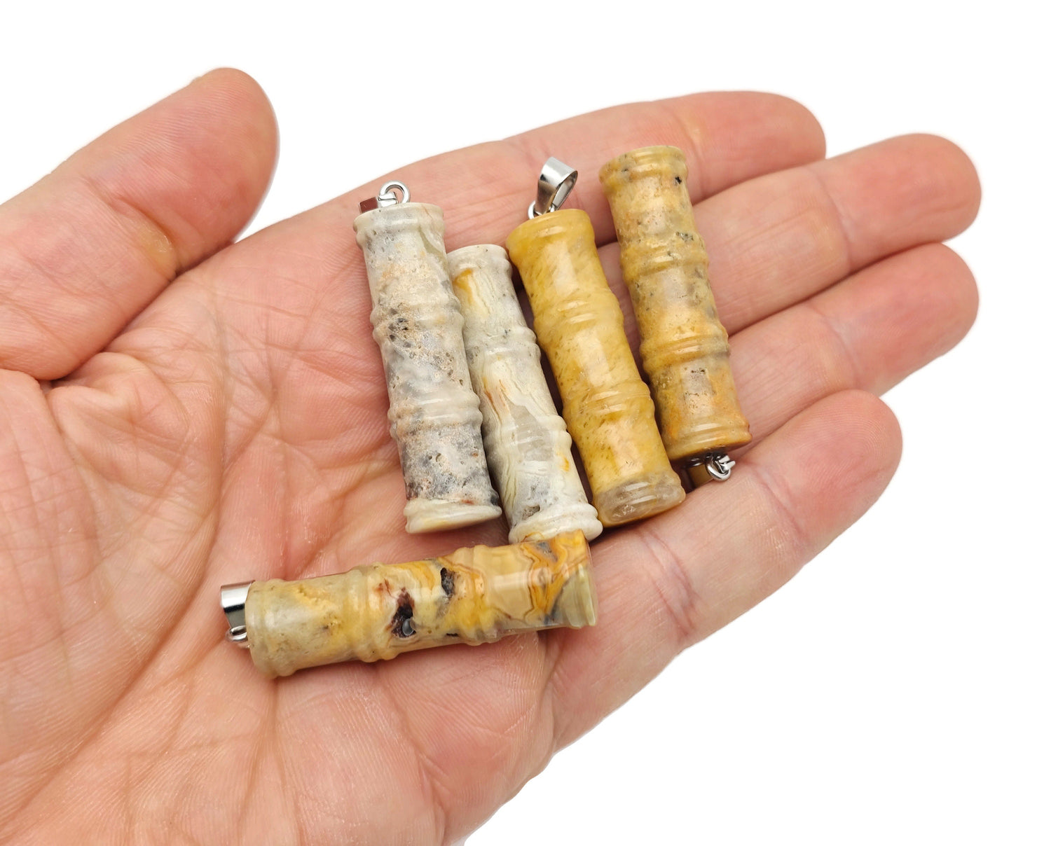 Crazy Lace Agate bamboo-shaped crystal pendant by GemstoneGO, featuring a protective crystal design and vibrant lace patterns.