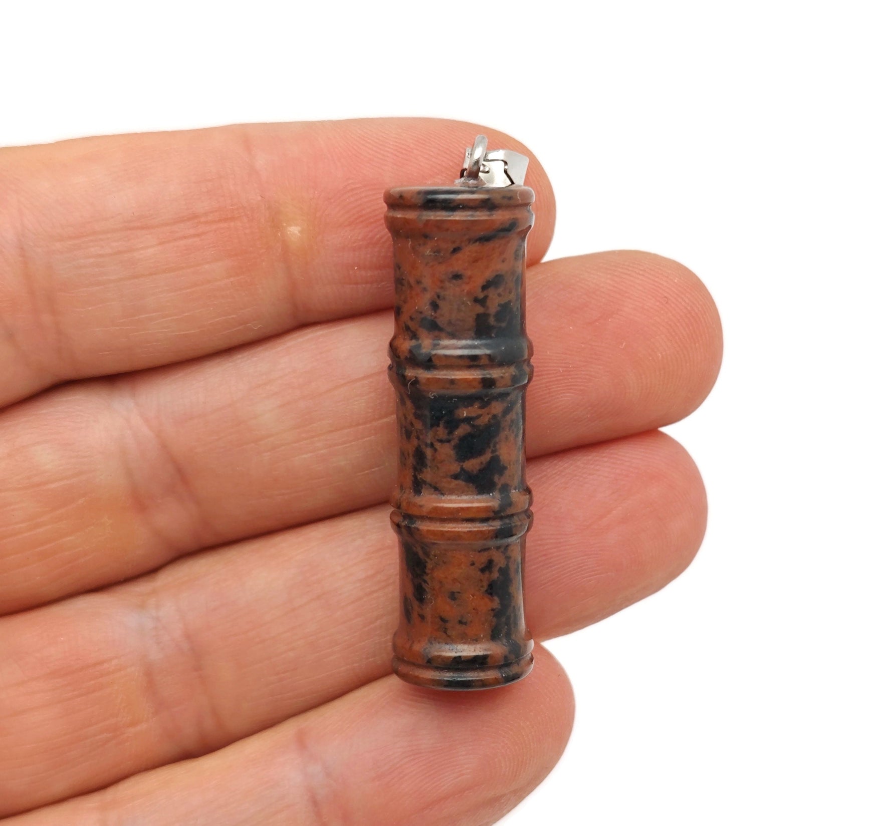 Mahogany Obsidian bamboo-shaped crystal pendant from GemstoneGO, featuring a protective crystal design on a silver chain