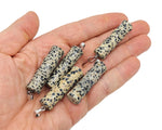 Dalmatian Jasper bamboo-shaped crystal pendant from GemstoneGO featuring protective crystal design on a silver chain.