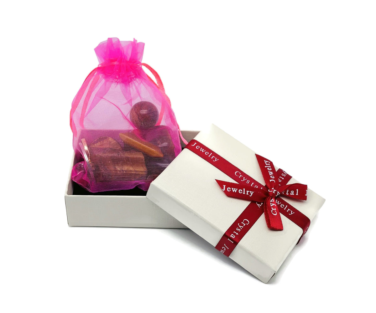 Set of 10 randomly selected gemstone crystals in a Crystal Mystery Box by GemstoneGO, featuring moon carvings for healing and collection.