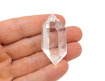 Clear Quartz double terminated point wand by GemstoneGO, featuring a transparent, polished crystal with pointed ends.