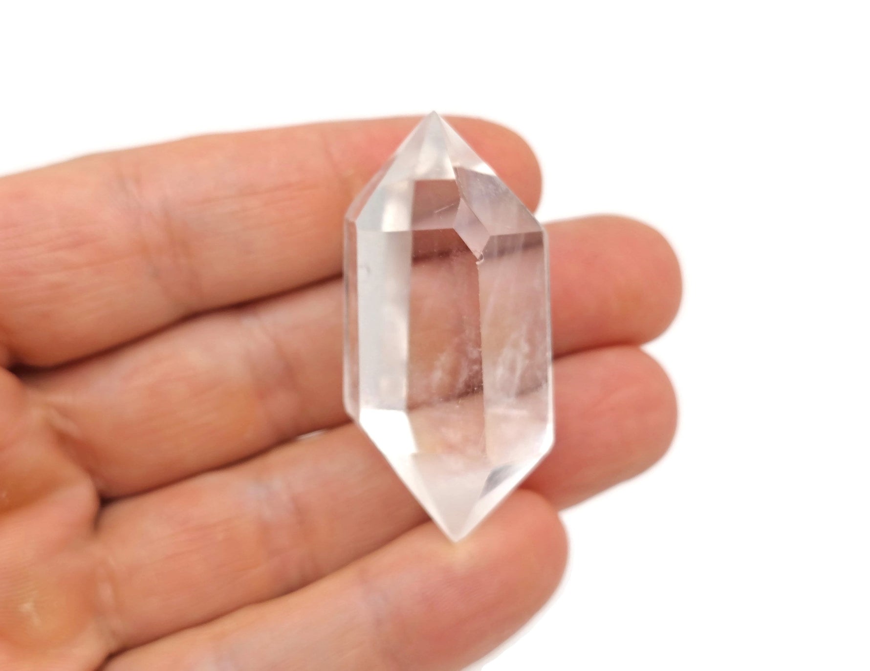 Clear Quartz double terminated point wand by GemstoneGO, featuring a transparent, polished crystal with pointed ends.