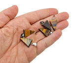 Triangle-shaped crystal pendant from GemstoneGO for jewelry making, shown in a close-up image of the faceted gemstone.