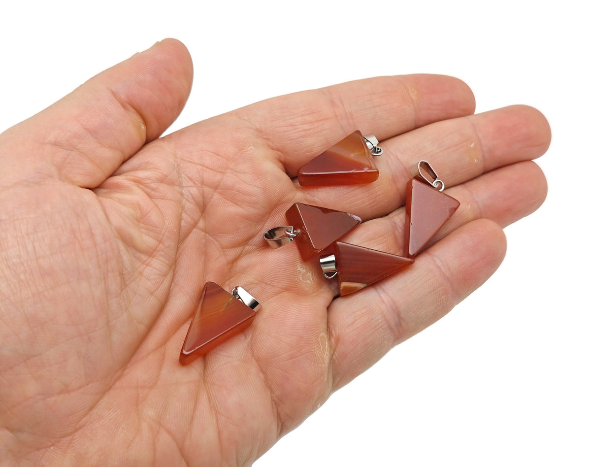 Triangle-shaped crystal pendant for jewelry making by GemstoneGO, showcasing a clear, faceted gemstone in a close-up view.
