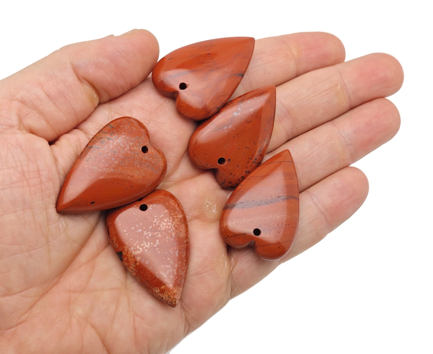 Long heart-shaped love crystal pendant with gemstone, featuring a large sharp heart design, from GemstoneGO.