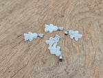 Clear quartz gingerbread cookies men crystal pendant with mineral specimens, featuring intricate gemstone details from GemstoneGO.