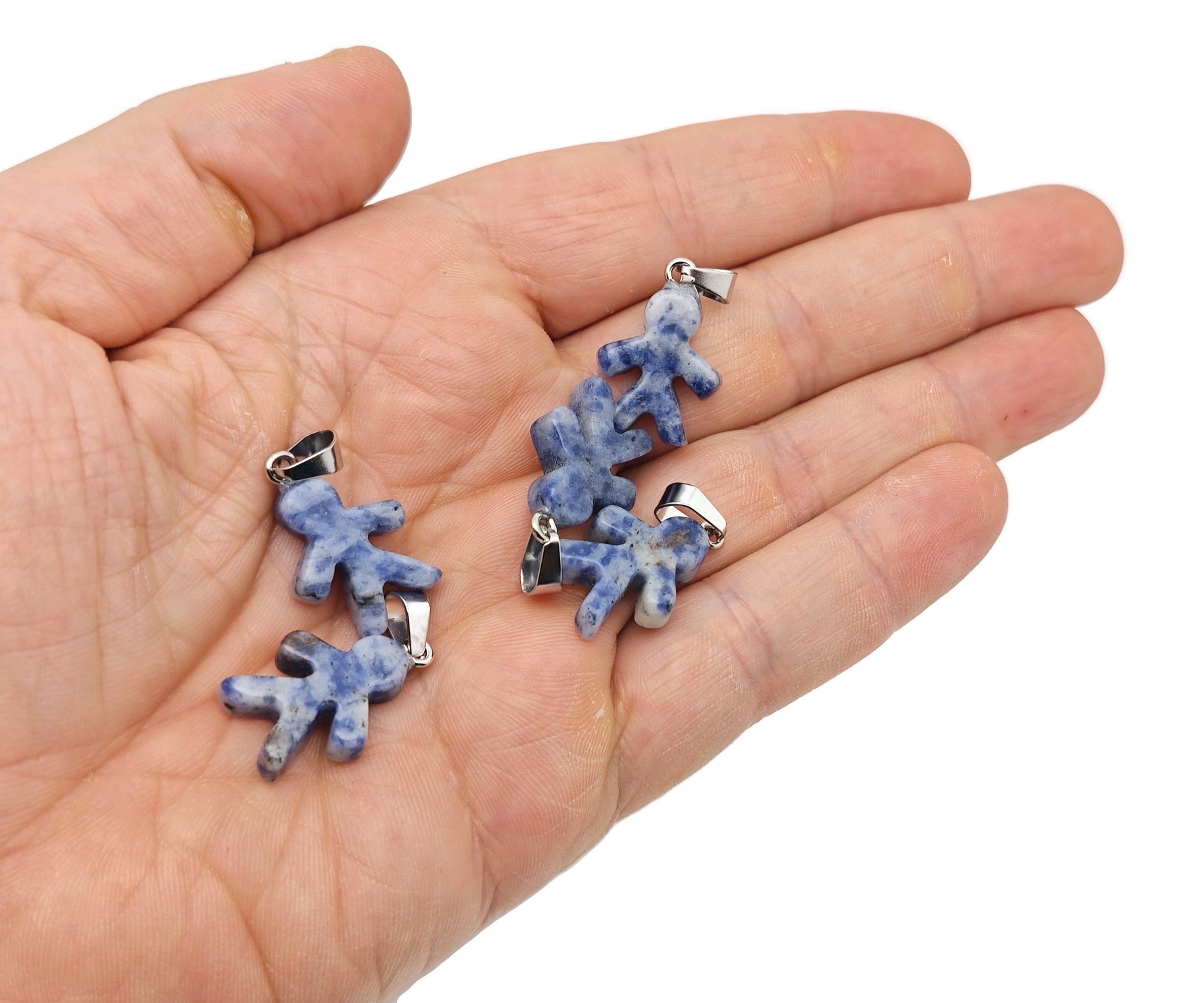 Sodalite gingerbread-shaped crystal pendant featuring mineral specimens with intricate blue and white mineral patterns.