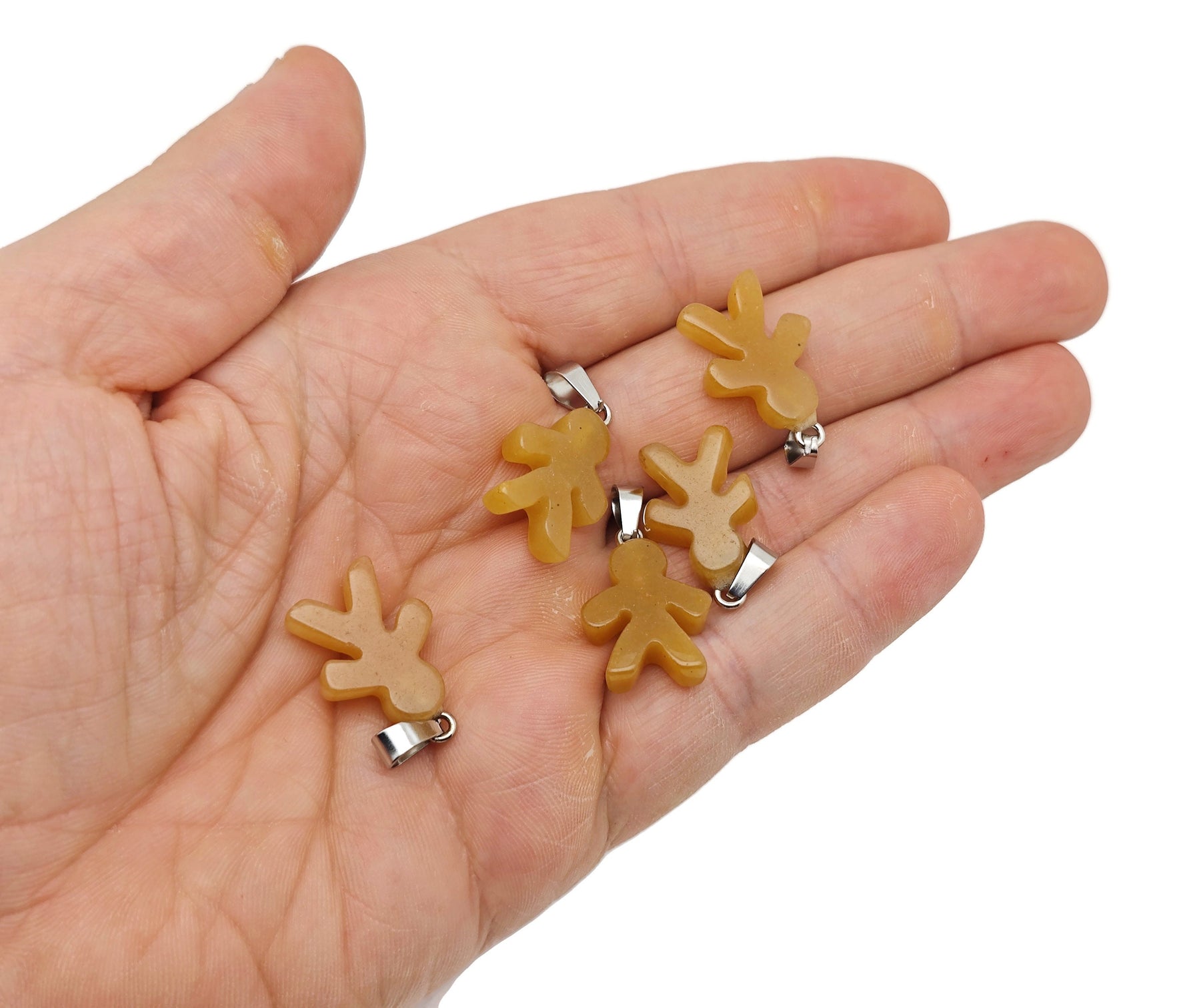 Yellow jade gingerbread cookies men crystal pendant from GemstoneGO, showcasing a detailed mineral specimen with vibrant yellow color.