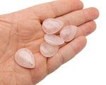 Dainty rose quartz crystal pendant for DIY jewelry making, featuring a smooth, polished drop shape with a silver bail.