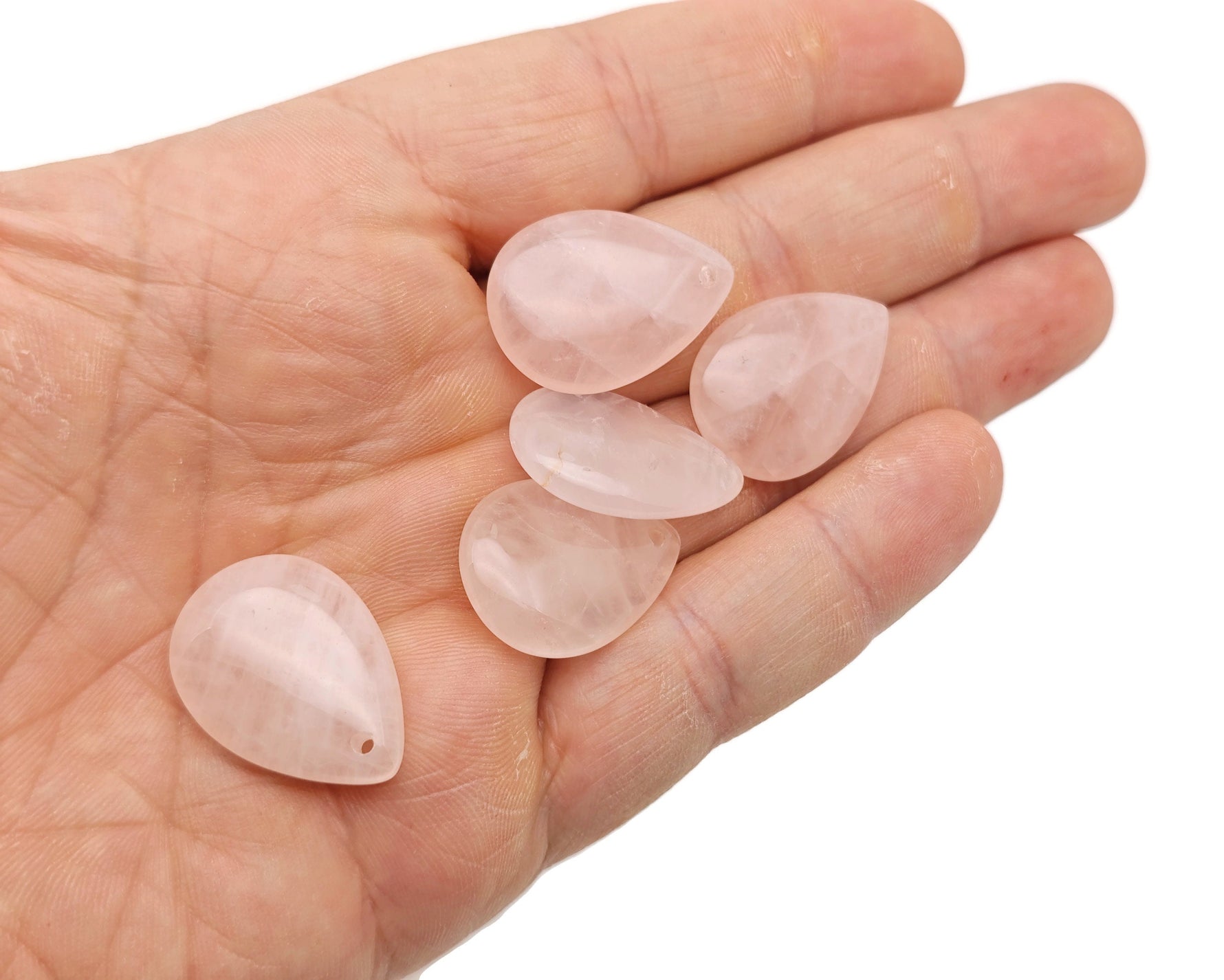Dainty rose quartz crystal pendant for DIY jewelry making, featuring a smooth, polished drop shape with a silver bail.