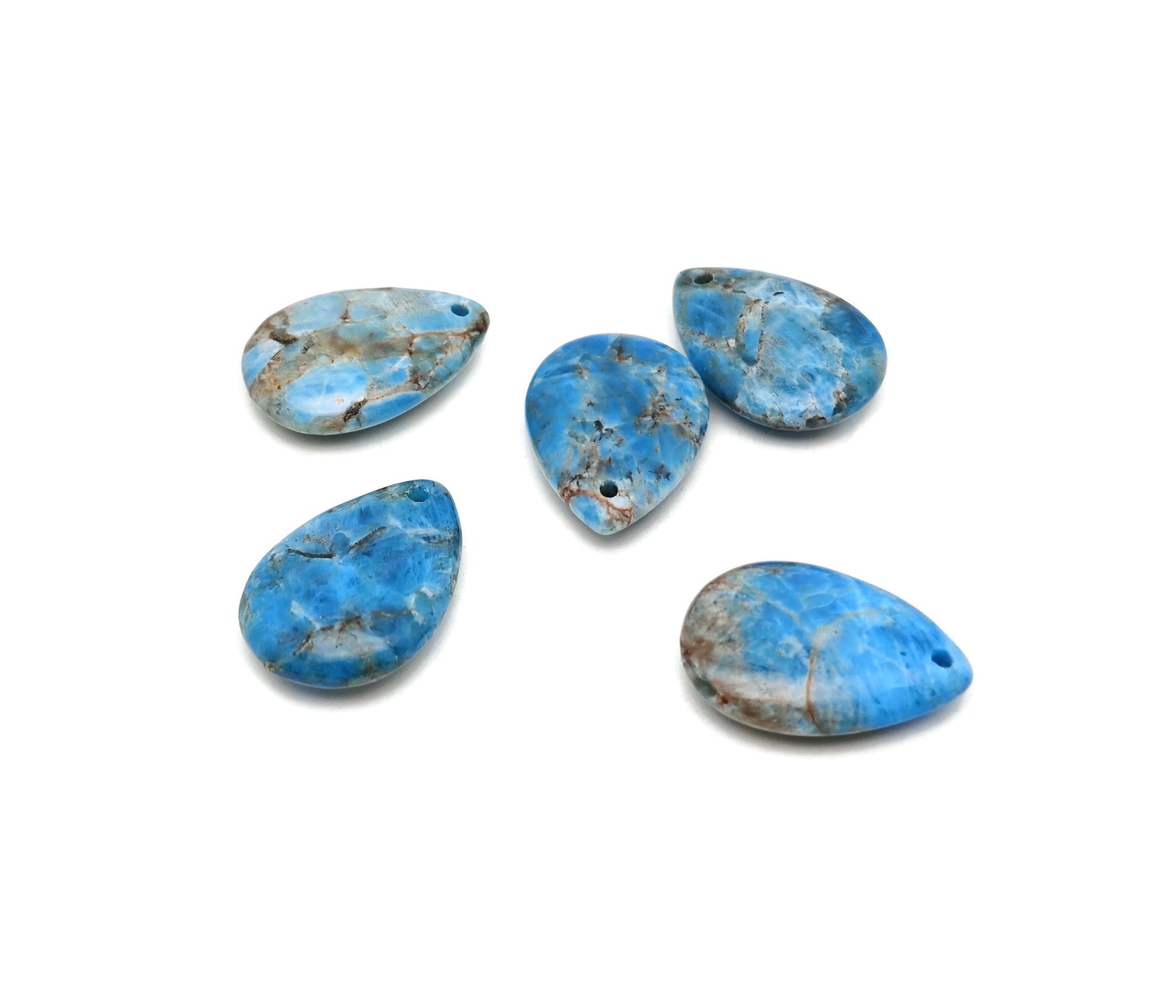 Blue Apatite dainty drop crystal pendant for DIY jewelry making, featuring a polished blue gemstone on a delicate silver chain.