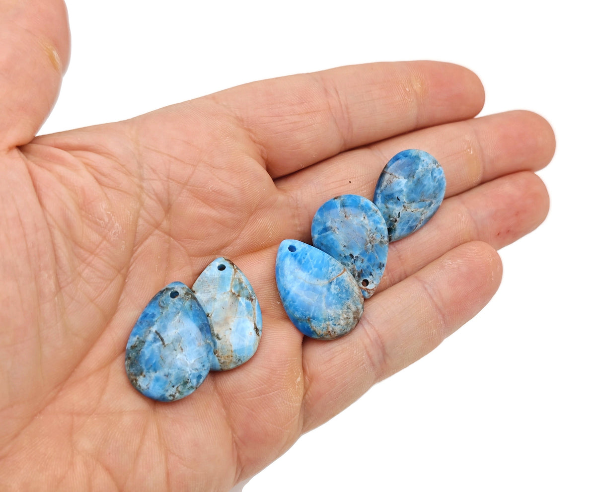 Blue Apatite dainty drop crystal pendant from GemstoneGO, perfect for DIY jewelry making, shown close-up with a silver bail.