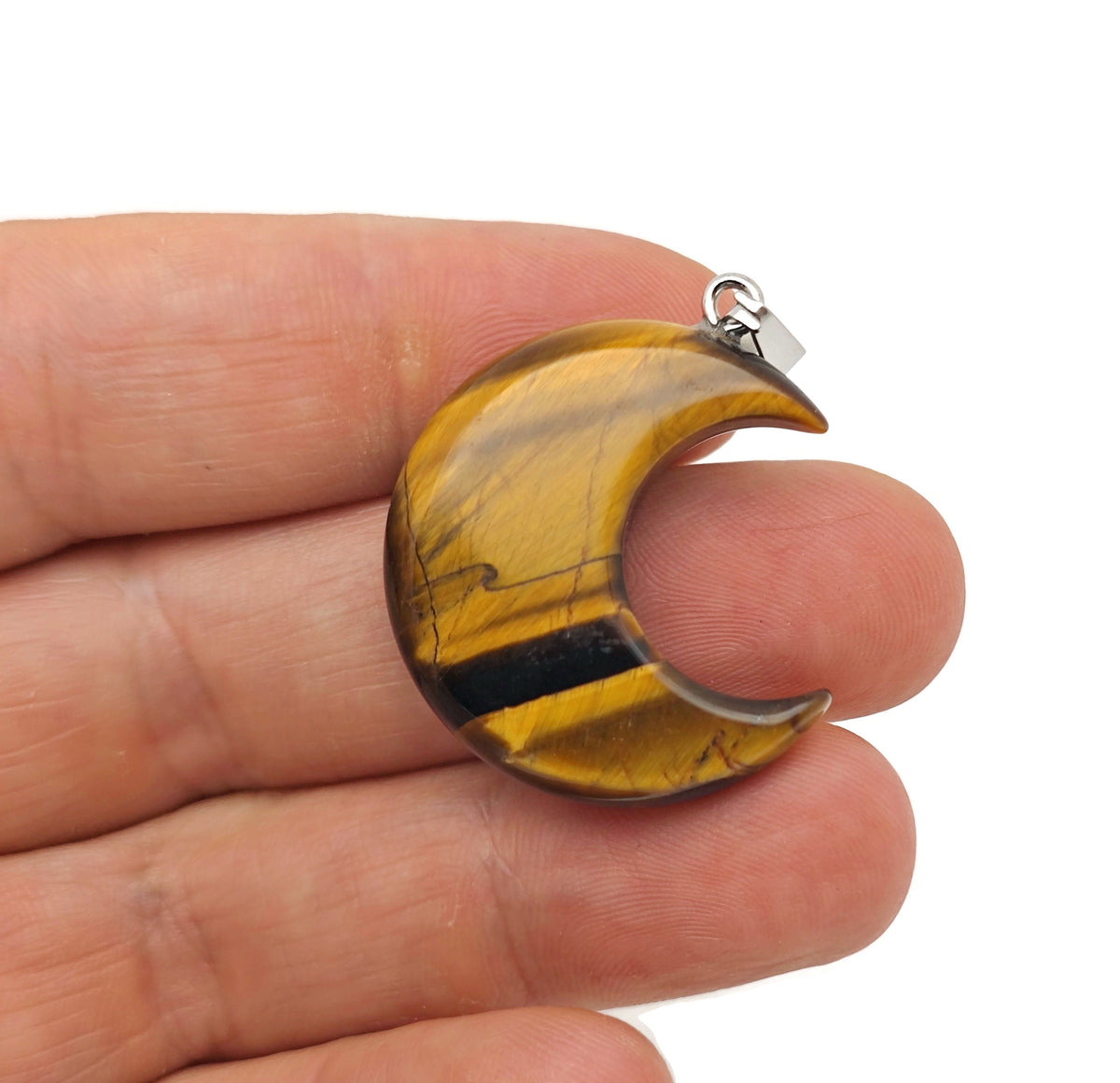 Tiger Eye moon gemstone pendant featuring a crescent moon design from GemstoneGO, showcasing warm, polished tiger eye stone.