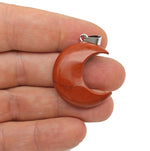 Red Jasper moon gemstone pendant featuring a crescent moon design from GemstoneGO.