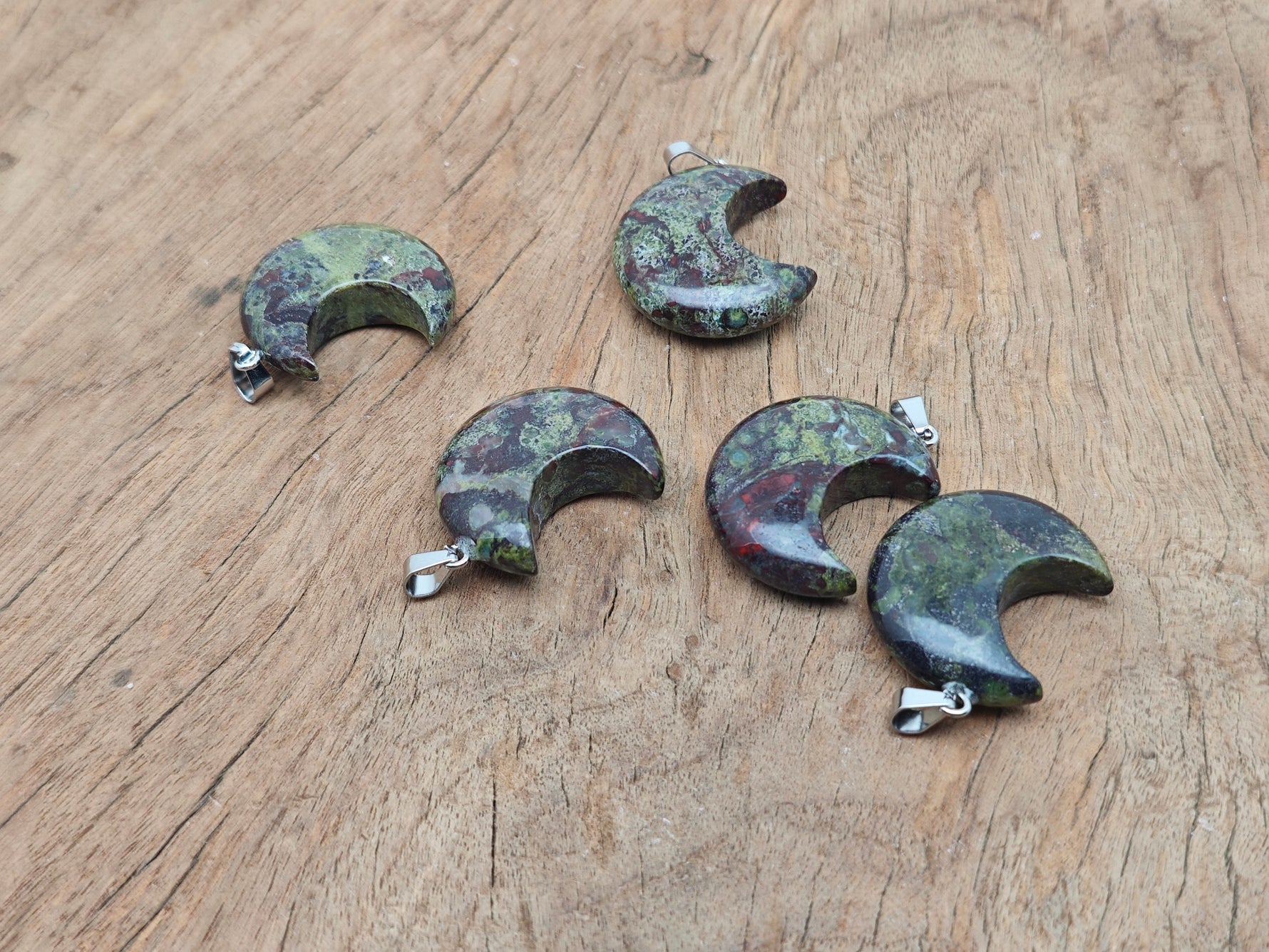 Dragon Blood Jasper moon pendant featuring a crescent moon design from GemstoneGO, showcasing the rich red and brown gemstone details.