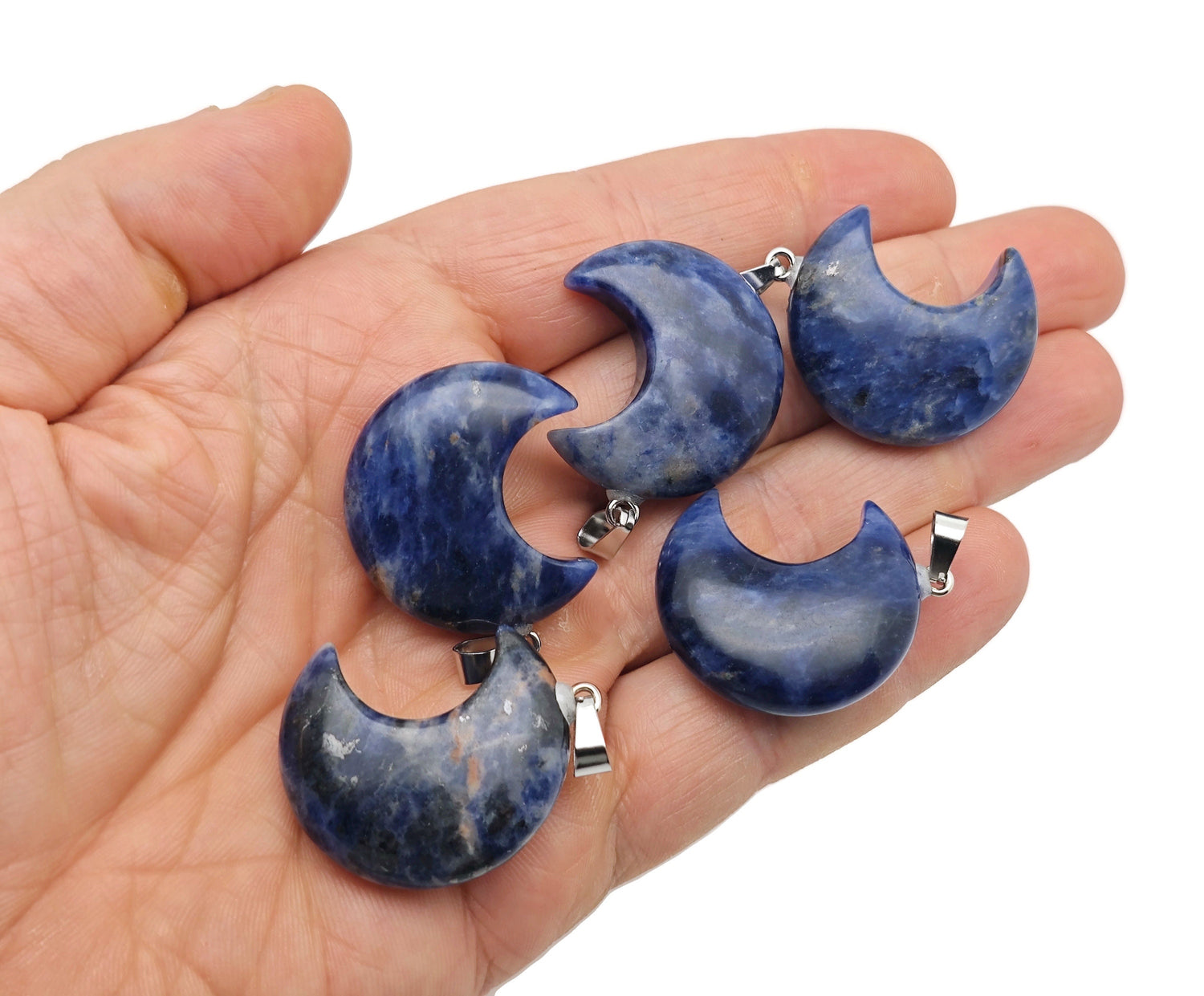 Sodalite moon gemstone pendant with a crescent moon design, crafted by GemstoneGO, featuring deep blue and white mineral patterns.