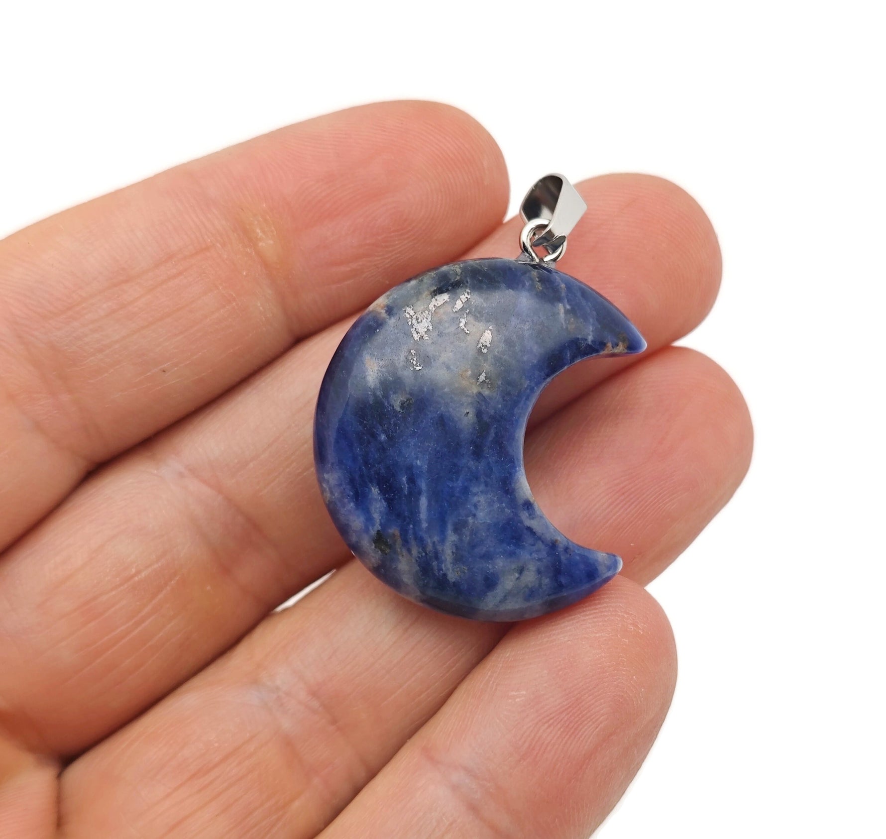 Sodalite moon gemstone pendant featuring a crescent moon design, crafted by GemstoneGO, with deep blue and white mineral patterns.
