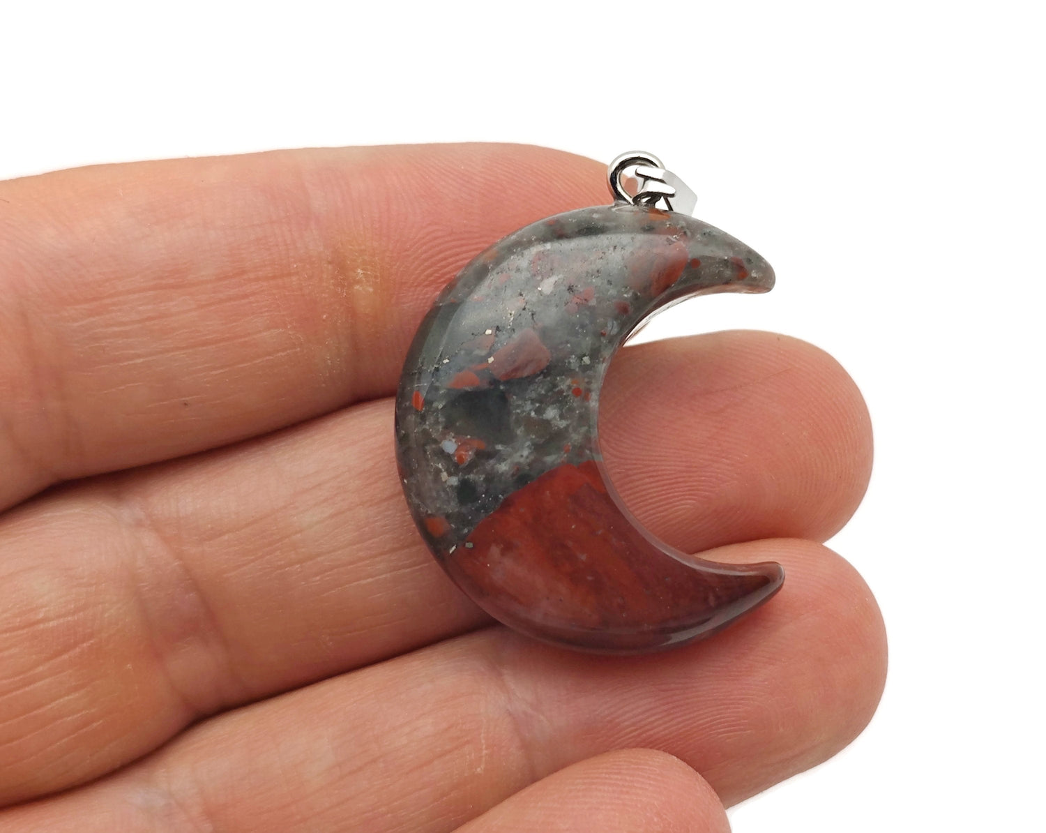 African Bloodstone moon gemstone pendant featuring a crescent moon design by GemstoneGO, showcasing rich red and green hues.