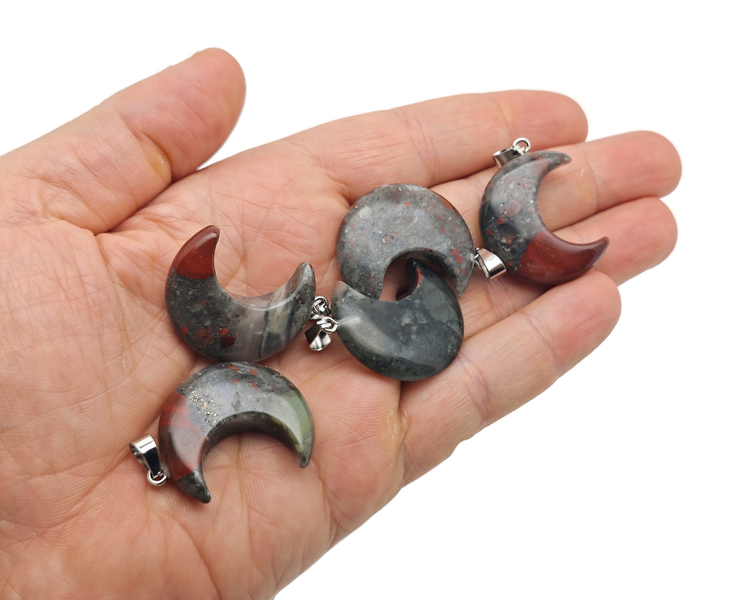 African Bloodstone moon gemstone pendant featuring a crescent moon shape, crafted by GemstoneGO.