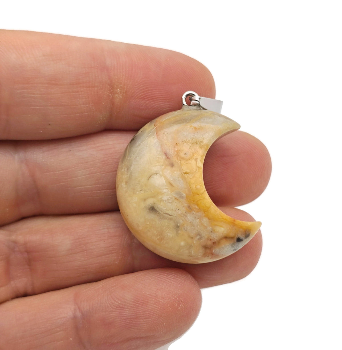 Crazy Lace Agate gemstone pendant featuring a crescent moon shape, showcasing vibrant patterns and natural gemstone details.