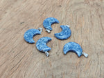 Blue Spot Jasper moon pendant featuring a crescent moon design from GemstoneGO, showcasing a polished gemstone with intricate patterns.