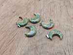 Unakite moon gemstone pendant featuring a crescent moon shape, crafted by GemstoneGO, with natural pink and green hues.