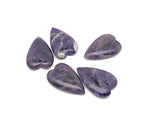 Heart-shaped amethyst love crystal pendant with a polished gemstone, showcasing a vibrant purple hue and intricate carving.