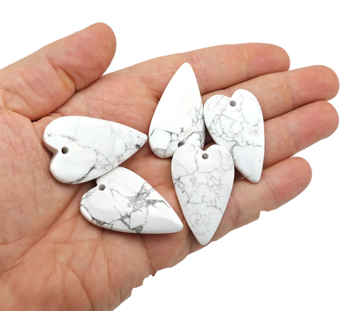 Heart-shaped Howlite love crystal pendant featuring a polished healing gemstone, perfect for jewelry and spiritual adornment.