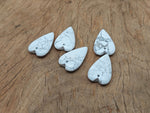 Heart-shaped Howlite love crystal pendant with a polished finish, perfect for healing and jewelry, by GemstoneGO.