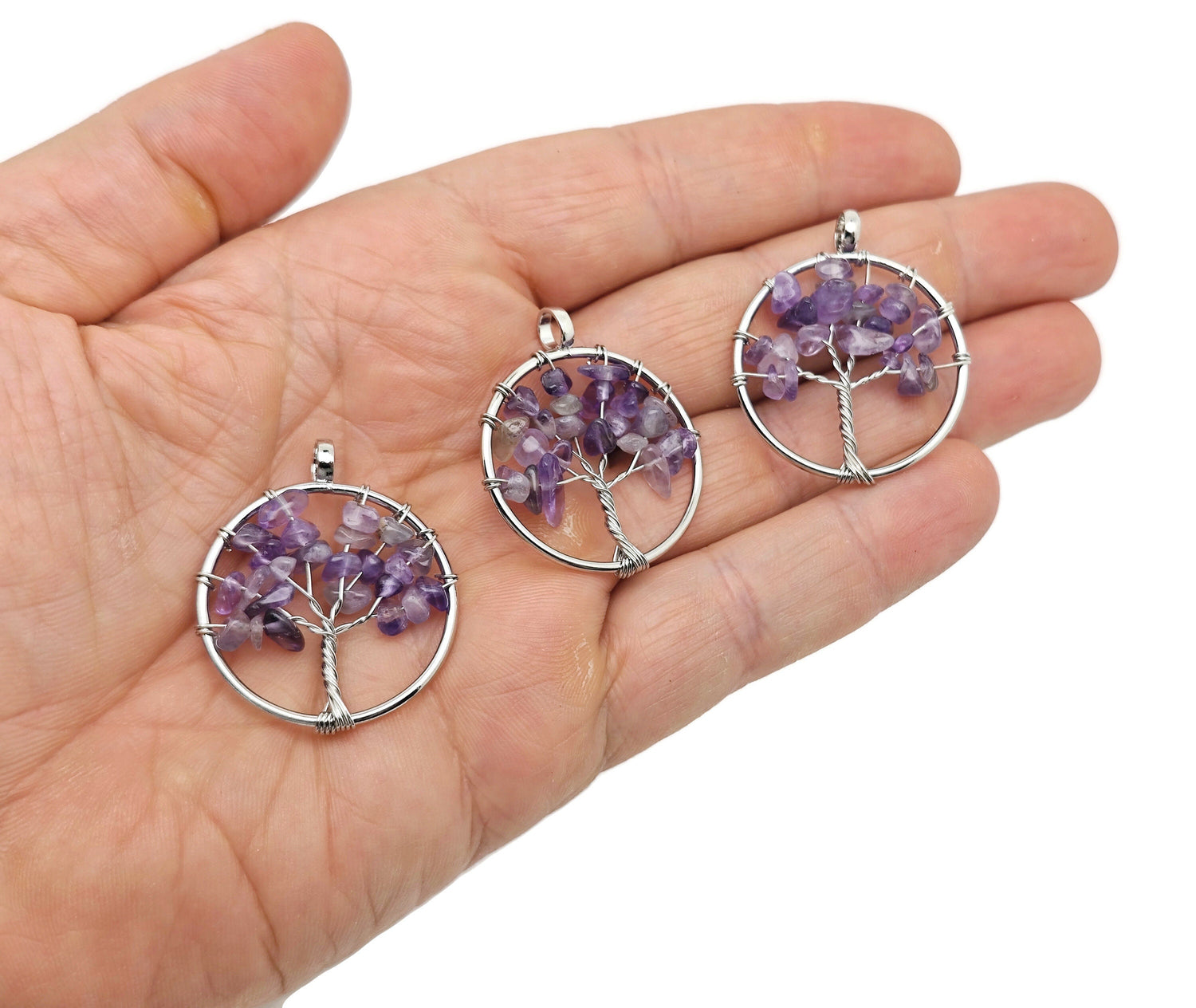 Amethyst Tree of Life gemstone pendant from GemstoneGO featuring a detailed crystal and metal tree design on a chain.