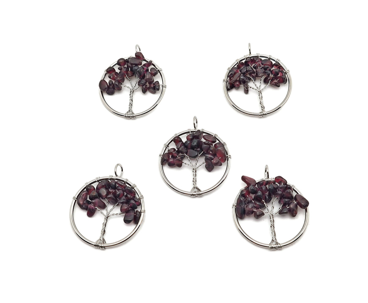 Garnet Tree of Life gemstone pendant from GemstoneGO featuring a detailed gemstone crystal design on a silver setting.
