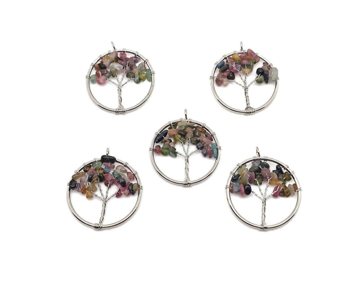 Rainbow tourmaline gemstone Tree of Life pendant with intricate wire wrapping, showcasing vibrant multicolored crystals.