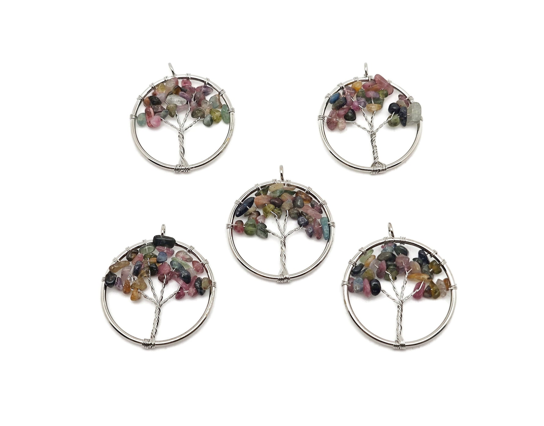 Rainbow tourmaline gemstone Tree of Life pendant with intricate wire wrapping, showcasing vibrant multicolored crystals.