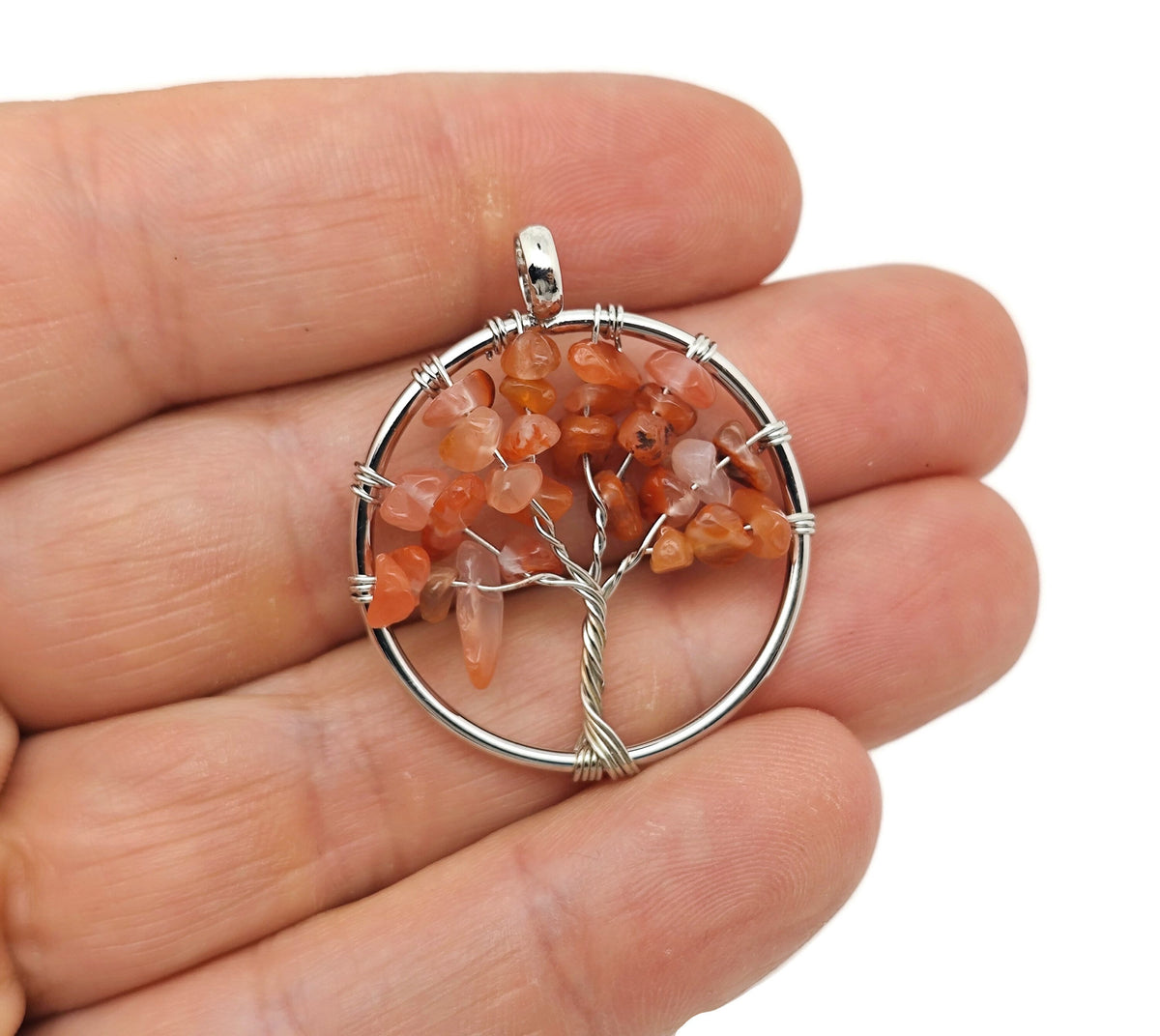 Carnelian Tree of Life gemstone pendant from GemstoneGO, featuring a detailed handcrafted design with vibrant orange carnelian stones.