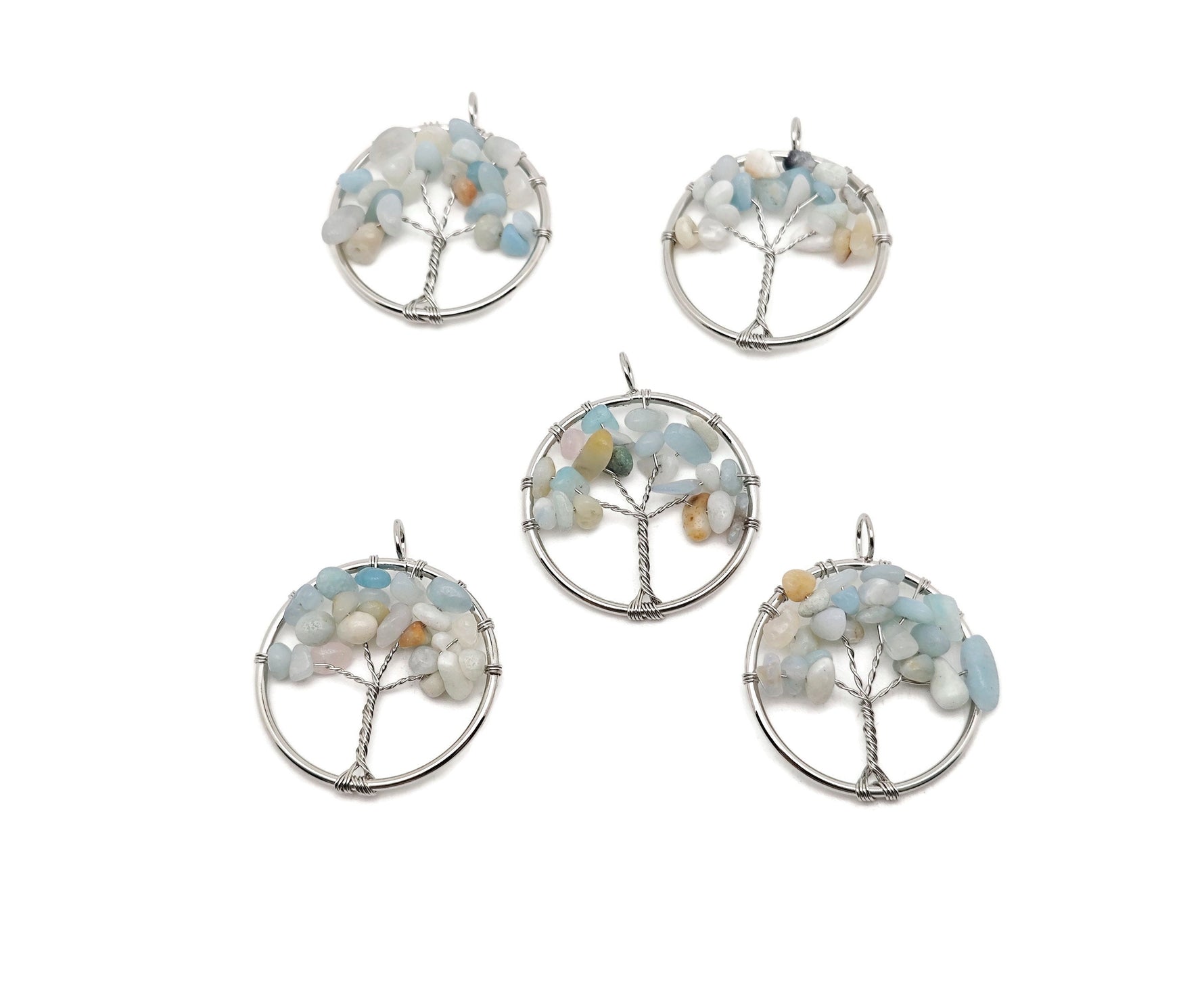Caribbean Calcite Tree of Life gemstone pendant from GemstoneGO, featuring colorful calcite crystals arranged in a detailed tree design.