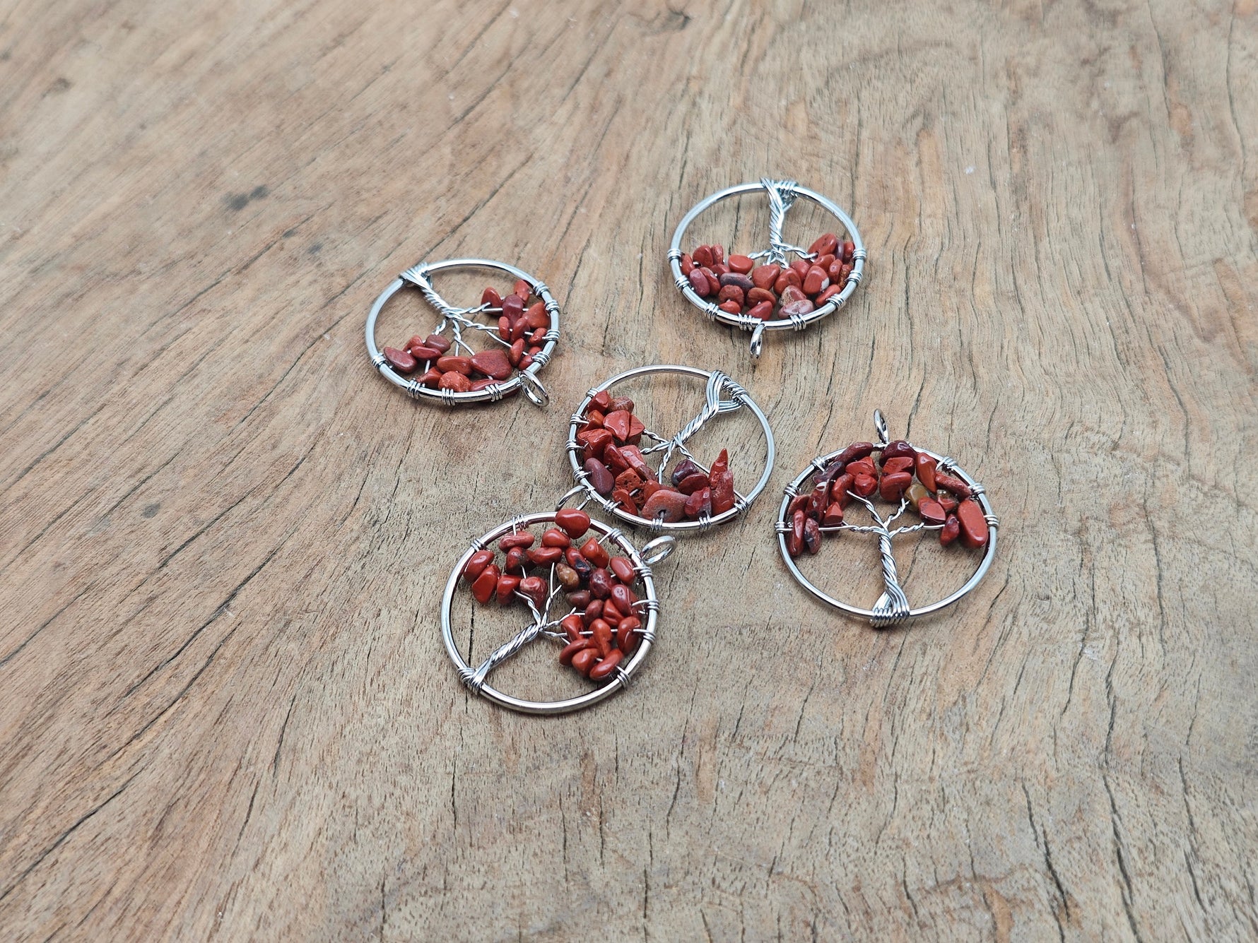 Red Jasper Tree of Life gemstone pendant from GemstoneGO, featuring a detailed red jasper carved tree of life design.