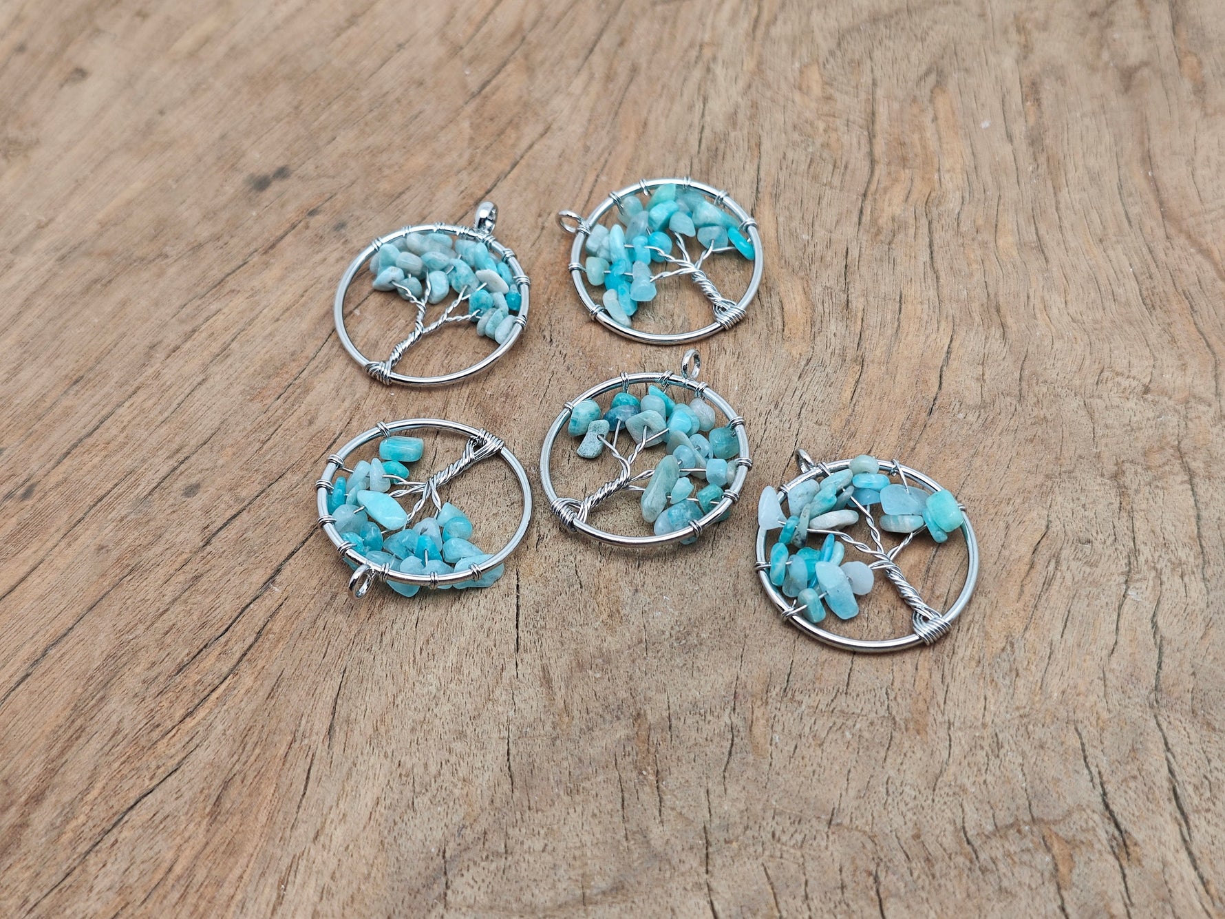 Amazonite Tree of Life gemstone pendant from GemstoneGO, featuring intricate wire wrapping and vibrant blue-green stones.