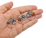 Seven chakra tree of life gemstone pendant with colorful gemstones on silver-toned chain, showcasing intricate design and vibrant colors.