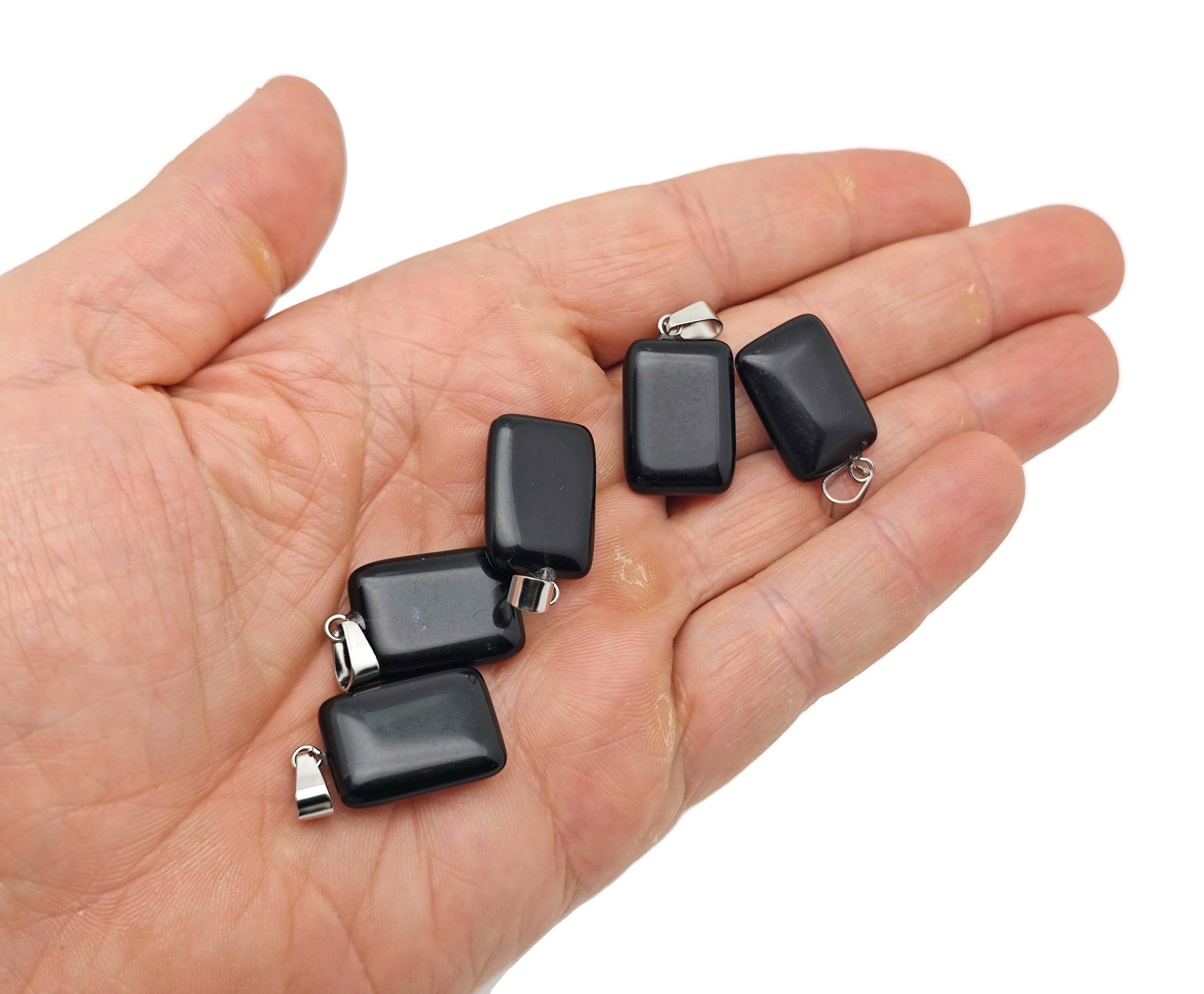 Obsidian rectangle-shaped crystal pendant from GemstoneGO, showcasing a smooth, polished black gemstone with natural stone textures.