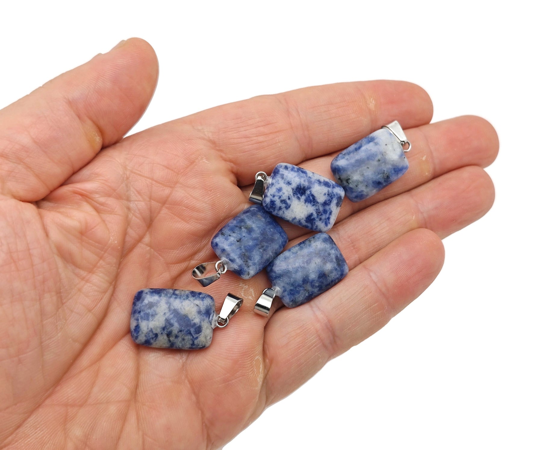 Sodalite rectangle-shaped crystal pendant from GemstoneGO, showcasing a deep blue gemstone with natural veining and polished finish.
