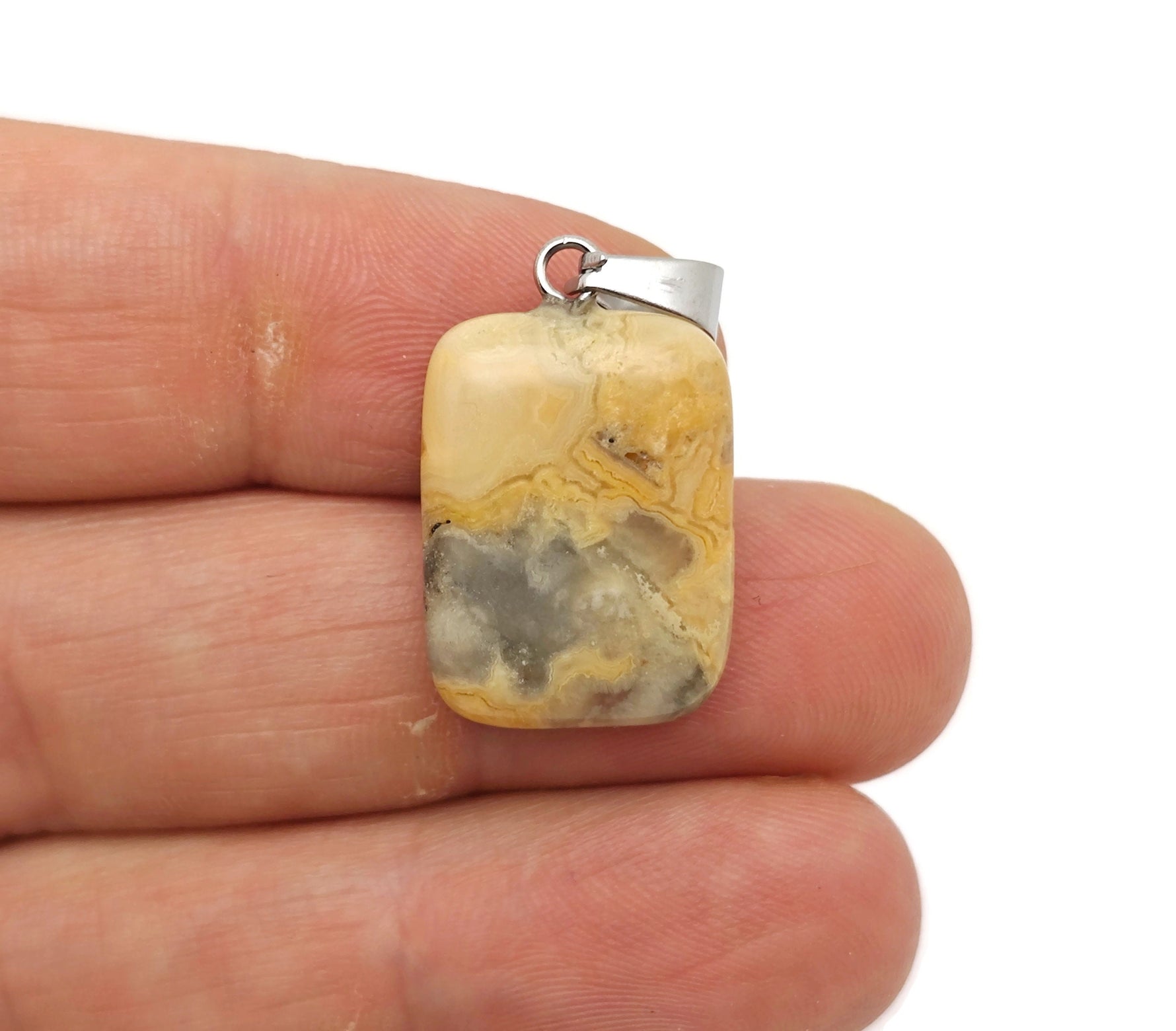 Rectangle-shaped Crazy Lace Agate crystal pendant from GemstoneGO featuring vibrant, intricate banding and natural gemstone details.